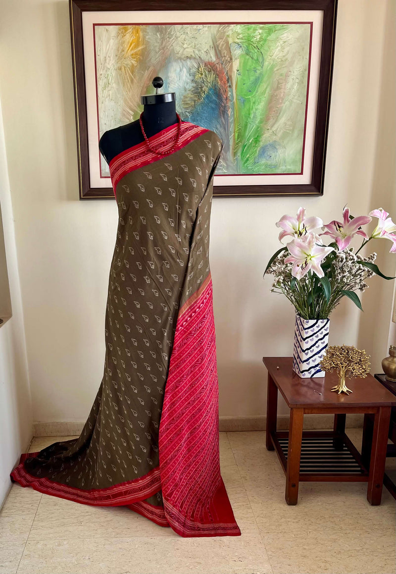 SAUDAMINI- SAMBALPURI HANDLOOM IKKAT SAREE IN OLIVE GREEN WITH COUNCH SHELL MOTIFS