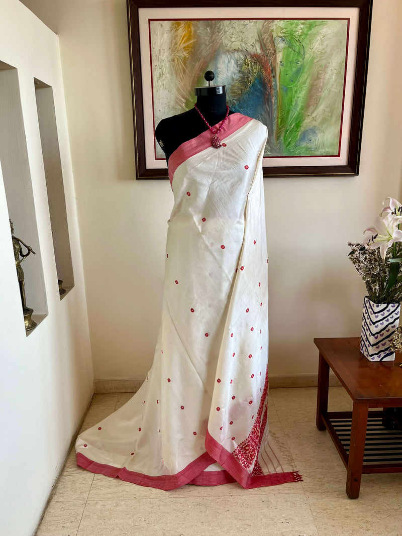 PRAGYASHREE – WHITE ASSAM SILK WITH RED BORDERS & BLOOMS