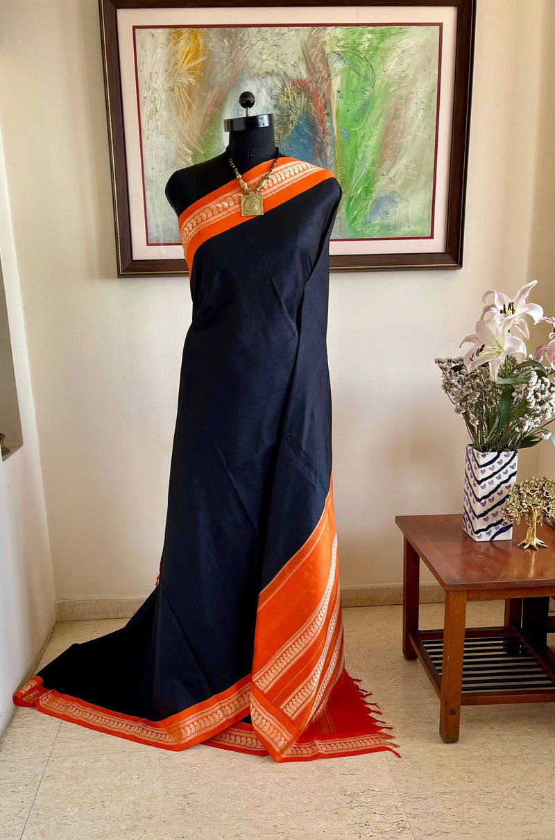 MAADHULYA-BOLD BLACK KORVAI KANJIVARAM WITH ORANGE AND GOLD PAISLEYS