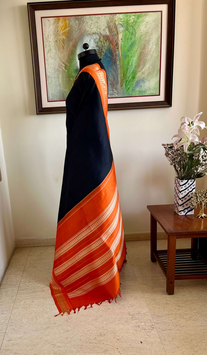 MAADHULYA-BOLD BLACK KORVAI KANJIVARAM WITH ORANGE AND GOLD PAISLEYS