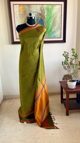 OORMIKA – KANJIVARAM SILK IN RICH GREEN AND ORANGE