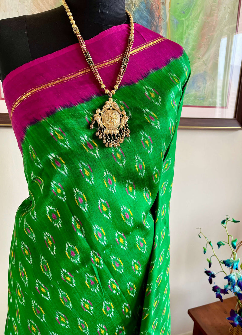 TANISHA- AN ELEGANT GREEN AND MAGENTA PATOLA SILK SAREE, A TIMELESS TALE OF BEAUTY AND ARTISTRY