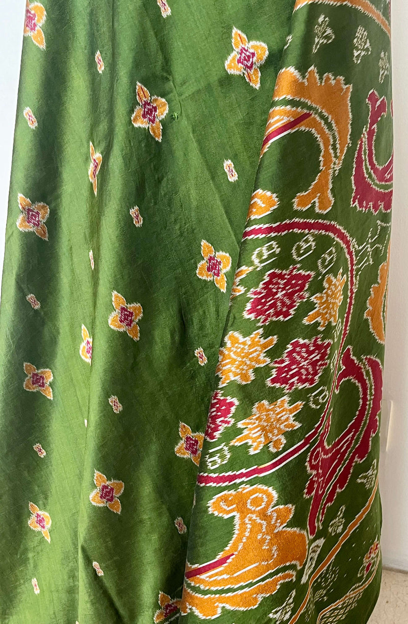 MISHA- EXQUISITE GREEN PATOLA WITH MAROON, OCHRE AND OFF-WHITE MOTIFS