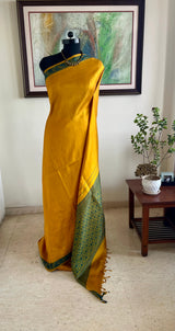 MAITREIKA – MUSTARD KANJIVARAM WITH AN ABUNDANT FLORAL AANCHAL