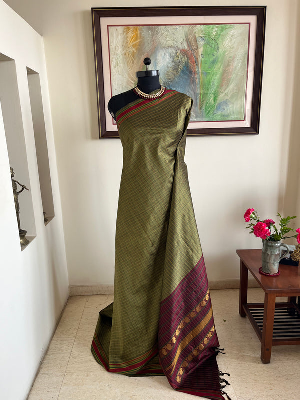 DEVOSHNI- OLIVE GREEN KANJIVARAM WITH CHECKS AND ZARI AANCHAL DETAILING