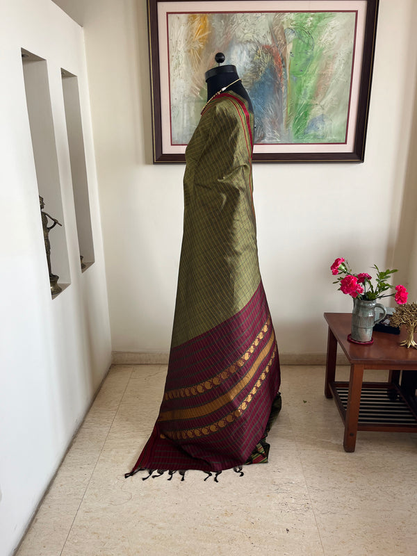 DEVOSHNI- OLIVE GREEN KANJIVARAM WITH CHECKS AND ZARI AANCHAL DETAILING