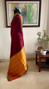 MEGAVALLI – MAROON KANJIVARAM WITH TEAL BORDER AND TEMPLE MOTIFS