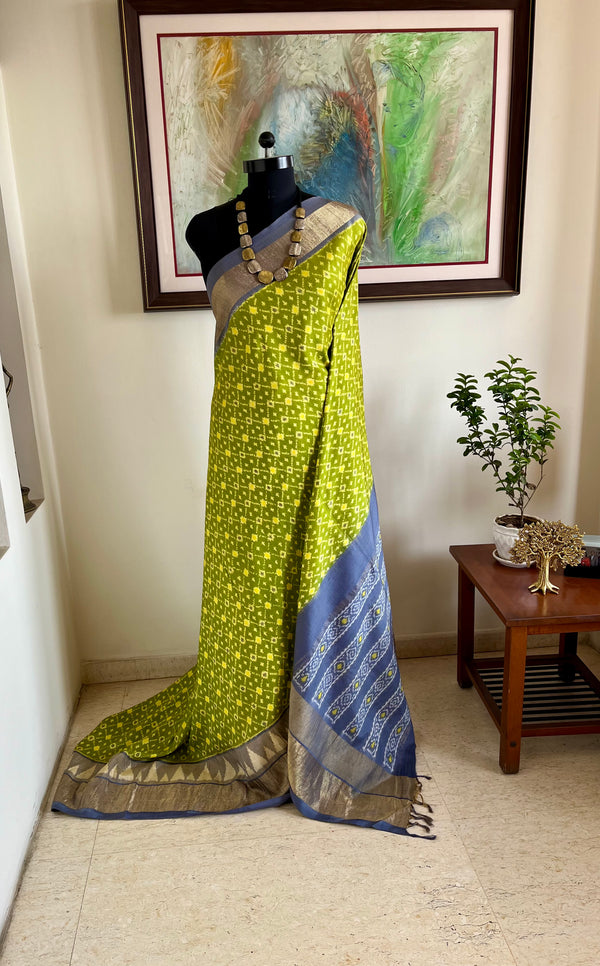 PRATIKAA– LEAF GREEN PATOLA WITH GREY AANCHAL AND ZARI