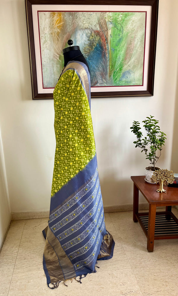 PRATIKAA– LEAF GREEN PATOLA WITH GREY AANCHAL AND ZARI