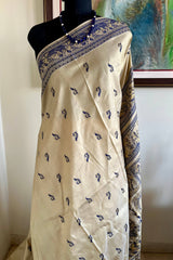 RITWIKA- ELEGANT BEIGE BALUCHARI SILK WITH RADHA-KRISHNA AND PEACOCK MOTIFS