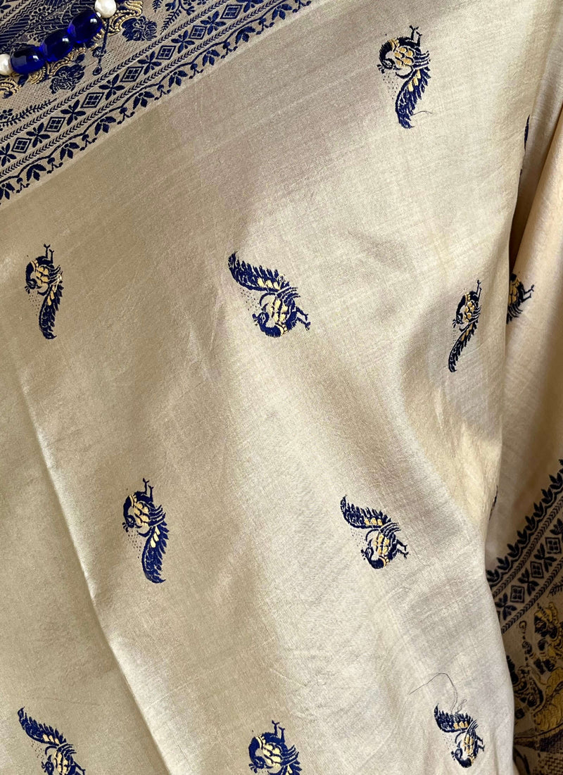 RITWIKA- ELEGANT BEIGE BALUCHARI SILK WITH RADHA-KRISHNA AND PEACOCK MOTIFS