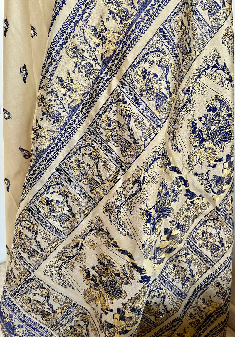 RITWIKA- ELEGANT BEIGE BALUCHARI SILK WITH RADHA-KRISHNA AND PEACOCK MOTIFS