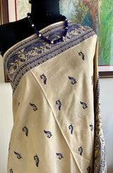 RITWIKA- ELEGANT BEIGE BALUCHARI SILK WITH RADHA-KRISHNA AND PEACOCK MOTIFS