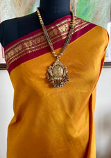 RAGAVI- GOLDEN YELLOW KORVAI KANJIVARAM WITH PEACOCK ZARI BORDER
