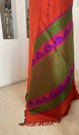 MRIDULIKA – RUST KANJIVARAM WITH REGAL PEACOCK WEAVES