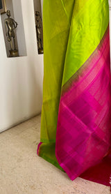 PARNAVI — LEAF GREEN KANJIVARAM WITH A STRIKING PINK AANCHAL