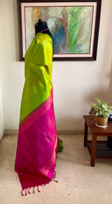 PARNAVI — LEAF GREEN KANJIVARAM WITH A STRIKING PINK AANCHAL