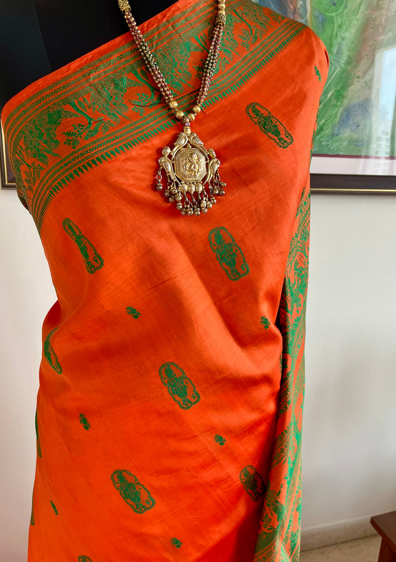 SANJOLI – ORANGE BALUCHARI SILK WITH KRISHNA RAS LEELA MOTIFS