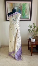 DIPANWITA – CREAM ASSAM SILK WITH ABUNDANT PURPLE FLORALS