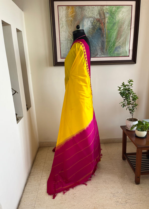 MINOLI – BRIGHT YELLOW KANJIVARAM WITH PINK TEMPLE BORDER