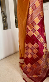 SNEHASMITA – BURNT ORANGE BOMKAI WITH A DISTINCTIVE GEOMETRIC AANCHAL