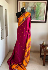 HASINI- MAGENTA KORVAI KANJIVARAM WITH ORANGE BORDER AND PETNI AANCHAL