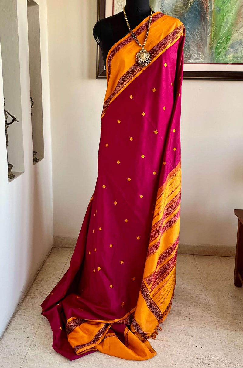 HASINI- MAGENTA KORVAI KANJIVARAM WITH ORANGE BORDER AND PETNI AANCHAL