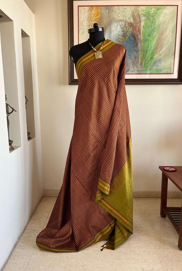 NIRVANI- BROWN KATTAM KANJIVARAM WITH PURPLE & MUSTARD CHECKS, PEACOCK MOTIFS, GREEN AANCHAL