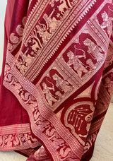 BHASWATI- MAROON BALUCHARI WITH PEACH WEAVES, MYTHOLOGICAL SCENES, AND FLORAL MOTIFS