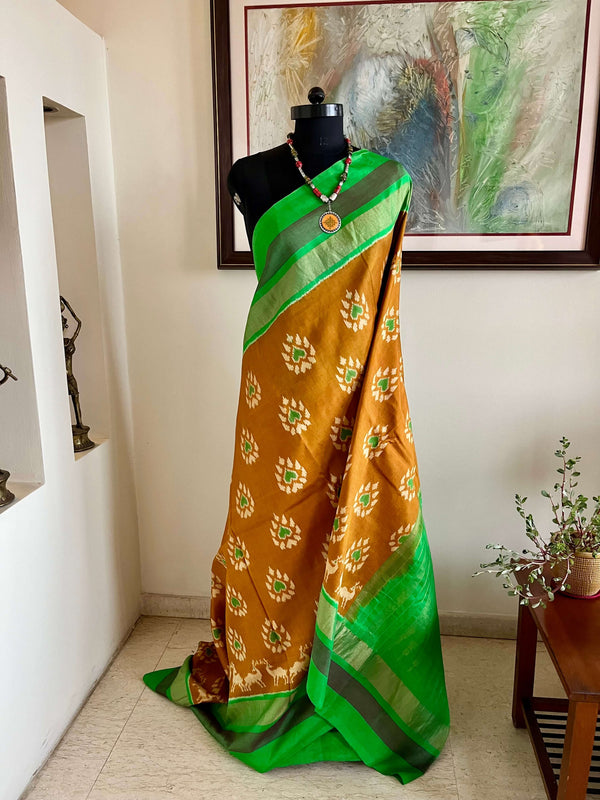 SAHELI- ELEGANT BROWN PATOLA IKKAT SAREE WITH ZARI BORDER & UNIQUE MOTIFS