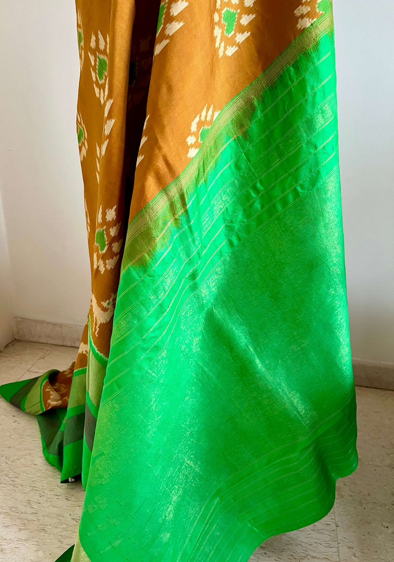 SAHELI- ELEGANT BROWN PATOLA IKKAT SAREE WITH ZARI BORDER & UNIQUE MOTIFS