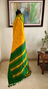 SAMARTHA – BRIGHT YELLOW FLORAL KANJIVARAM WITH PEACOCK BORDER