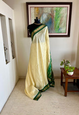 AARUTHIRA- ELEGANT CREAM KANJIVARAM SAREE WITH GREEN ZARI PEACOCK BORDER & BOOTIS