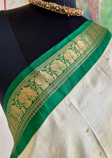 AARUTHIRA- ELEGANT CREAM KANJIVARAM SAREE WITH GREEN ZARI PEACOCK BORDER & BOOTIS