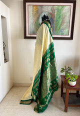 AARUTHIRA- ELEGANT CREAM KANJIVARAM SAREE WITH GREEN ZARI PEACOCK BORDER & BOOTIS