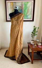 PRIYATHA – DARK BEIGE ASSAM SILK WITH BLACK RED AANCHAL