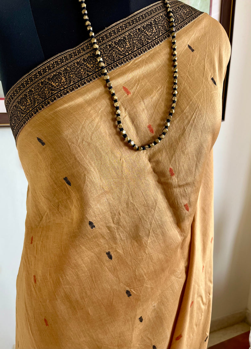 PRIYATHA – DARK BEIGE ASSAM SILK WITH BLACK RED AANCHAL