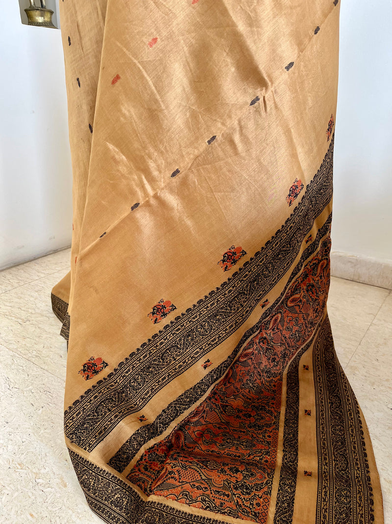 PRIYATHA – DARK BEIGE ASSAM SILK WITH BLACK RED AANCHAL