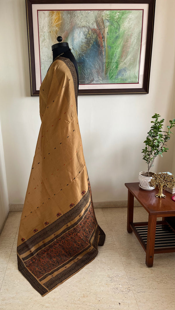 PRIYATHA – DARK BEIGE ASSAM SILK WITH BLACK RED AANCHAL