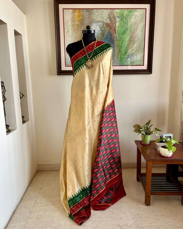 ASHMITHA- EXQUISITE CREAM PATOLA WITH MAROON-GREEN ACCENTS