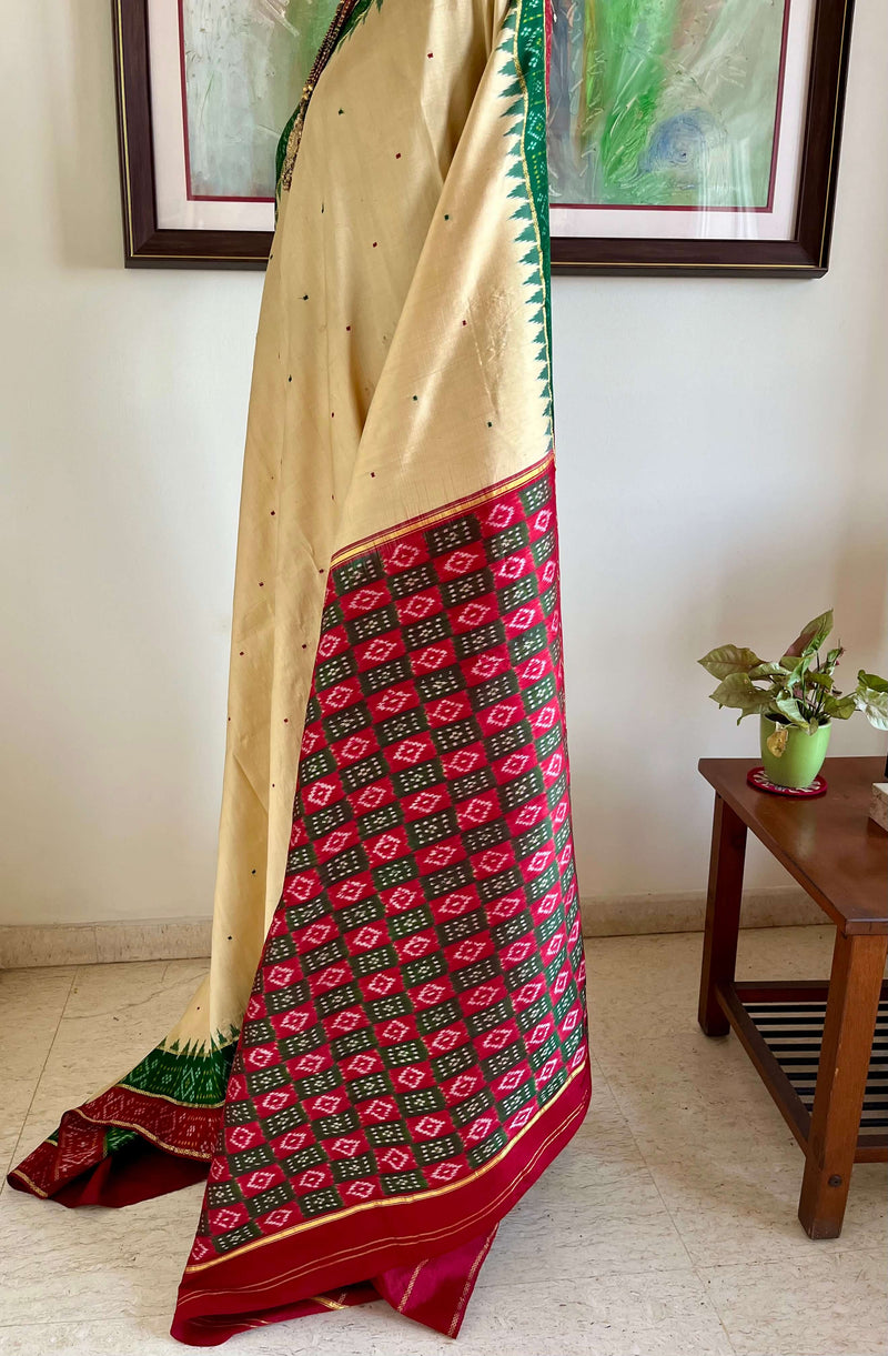 ASHMITHA- EXQUISITE CREAM PATOLA WITH MAROON-GREEN ACCENTS