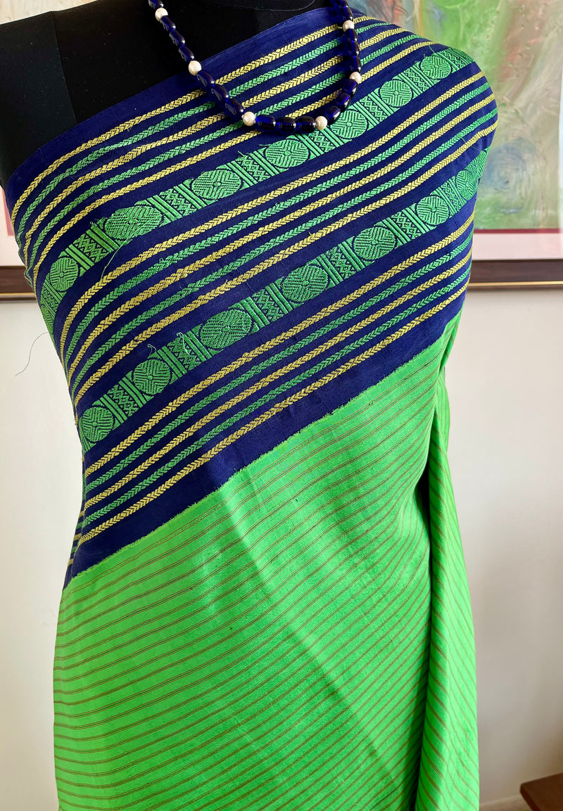 KALVIKA- GREEN KORVAI KANJIVARAM WITH CHEVRON AND RUDRAKSHA OVER NAVY