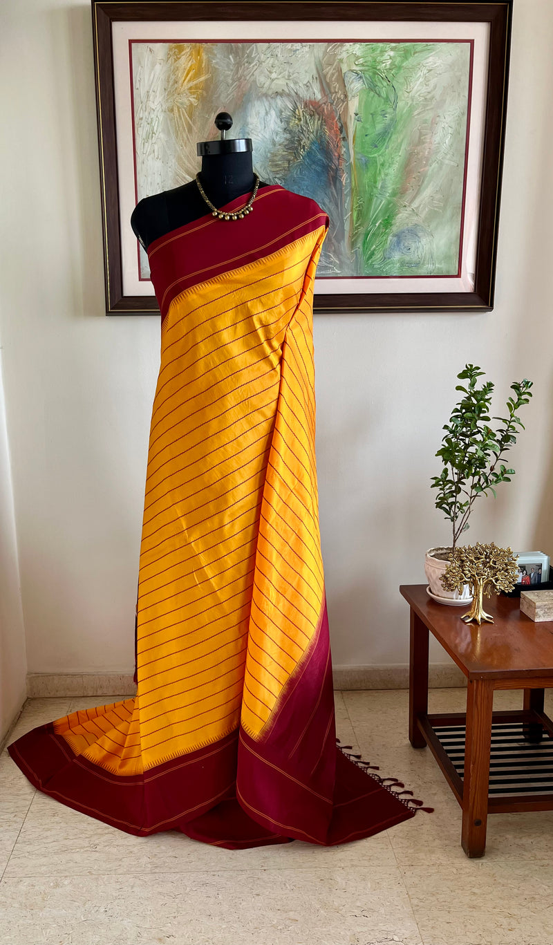 KANTHI- KORVAI VELDHARI KANJIVARAM IN YELLOW AND MAROON ELEGANCE