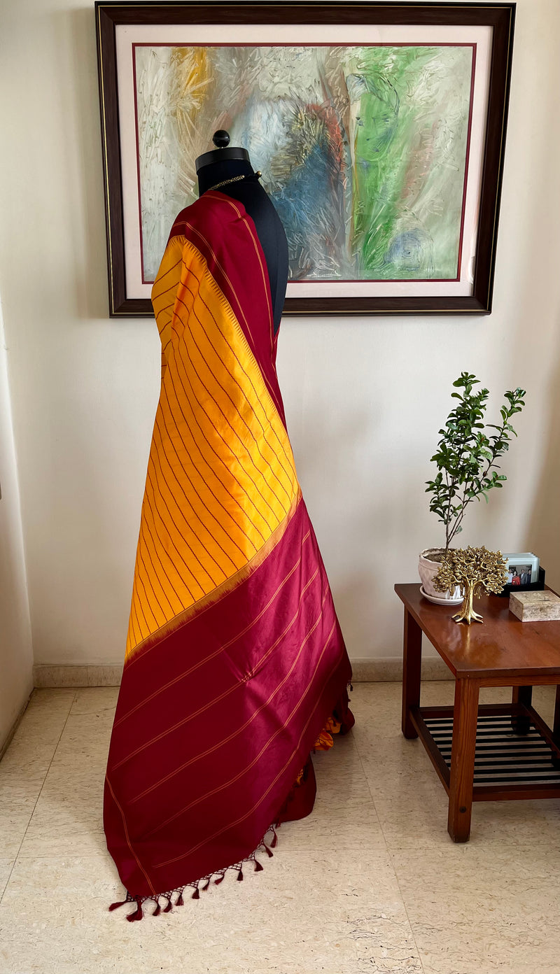KANTHI- KORVAI VELDHARI KANJIVARAM IN YELLOW AND MAROON ELEGANCE