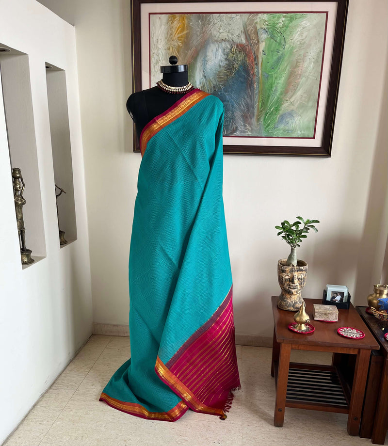 VRITIKA - SUBTLE BLUE GADWAL COTTON SAREE WITH RED ZARI BORDER