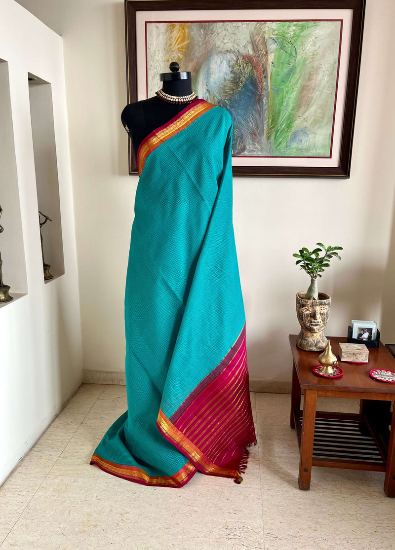 VRITIKA - SUBTLE BLUE GADWAL COTTON SAREE WITH RED ZARI BORDER