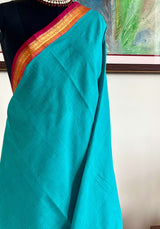 VRITIKA - SUBTLE BLUE GADWAL COTTON SAREE WITH RED ZARI BORDER