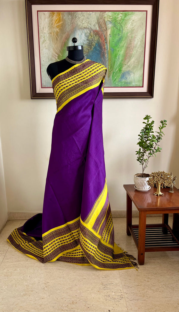 CHARINI – PURPLE KORVAI KANJIVARAM WITH YELLOW BORDER AND MOTIFS