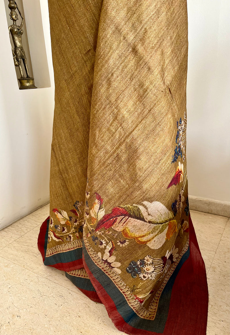 MANUBHA – DARK BEIGE TUSSAR WITH FLORAL PRINTS ON BORDER AND AANCHAL