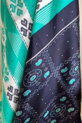 PRASHEELA - TEAL POCHAMPALLY SILK WITH FLORAL MOTIFS AND RUDRAKSHA BORDER